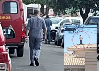 homem armado no telhado